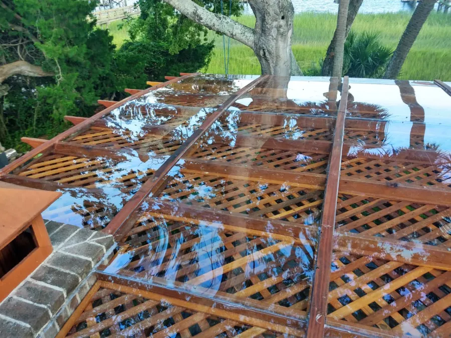 Custom Attached Arched Pergola Kits (Options: 22' L x 26' W, California Redwood, No Electrical Wiring Trim, Rafters at 18" and Slats at 18", 3-Post Anchor Kit for High-Wind, with Transparent Rain Guard, Ceiling Fan Base, No Privacy Panels, No Curtain Rods, 10' Post Height, Transparent Premium Sealant, Attached to Wall by Support Side, Arches are 2x12's by Custom Request). Photo Courtesy of M. Yocco of Hilton Head, South Carolina.
