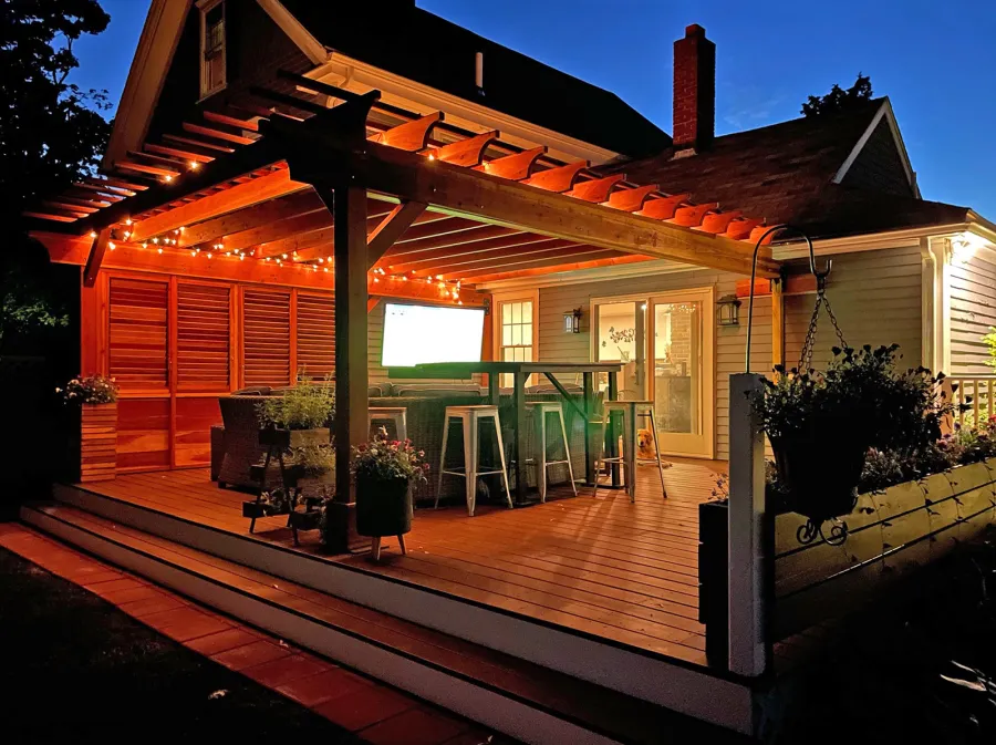 Attached Garden Pergolas (Options: 20' L x 17'-6" W, Attached to Wall by Rafter Side, California Redwood, No Electrical Wiring Trim, No Ceiling Fan Base, Open Roof with Slats at 12", No Rain Guard, 3-Post Anchor Kit for Wood, with Two 6x6 Posts and One 4x4 Post,  with 3x8 Extra Posts Against Wall by Custom Request, Transparent Premium Sealant). Photo Courtesy of I. Clarkson of Abington, Massachusetts.