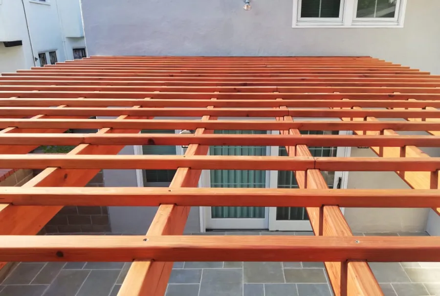 Attached Garden Pergola (Options: 13'-6" x 16'-6", Mature Redwood, Open Roof with Slats at 6", Rafters at 18", 2-Post Anchor Kit for Concrete, No Ceiling Fan Base, Transparent Premium Sealant). Photo Courtesy of J. Mason of Alameda, California.