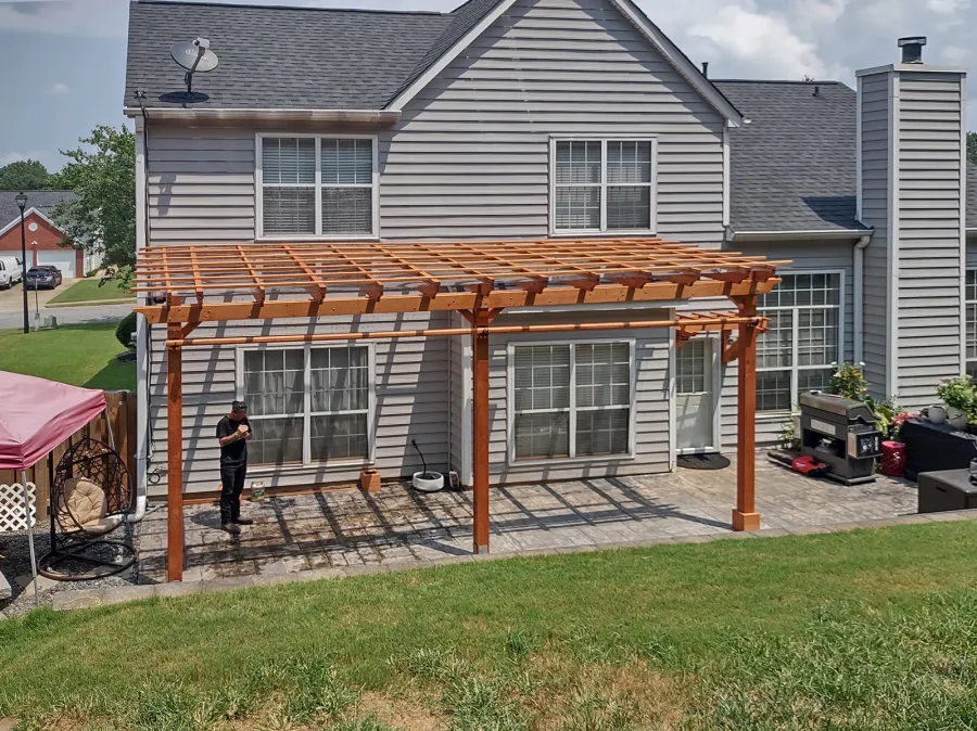 Attached Garden Pergolas (Options: 24'-6" L x 10' W, Attached to Wall by Support Side, Douglas-fir, Electrical Wiring Trim for 1 Post, 2 Ceiling Fan Bases, Open Roof with Slats at 18", with Rain Guard, 3-Post Anchor Kit for Concrete, Sloped Rafters by Custom Request, Transparent Premium Sealant).