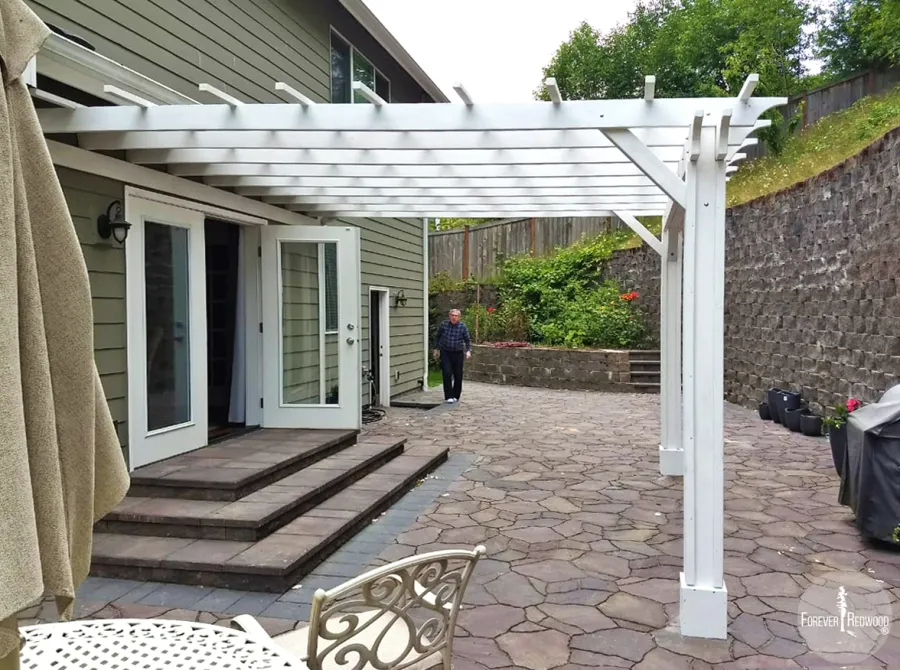 Attached Garden Pergolas (Options: 14' x 14', Attached to Wall by Supports Side, Douglas-fir, Electrical Wiring Trim for 2 Posts, Open Roof with Slats at 18", Vertical Decorative Trims on Posts, Off-White Oil-Based Primer).