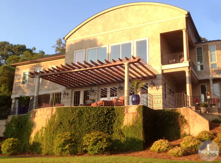 Attached Garden Pergolas (Options: 30' L x 14' W, Mature Redwood, No Electrical Wiring Trim, Open Roof with Slats at 12", Posts Wrapped with Columns After Installation, Transparent Premium Sealant). Photo Courtesy of Casey Graybeal of Gainesville, Georgia.