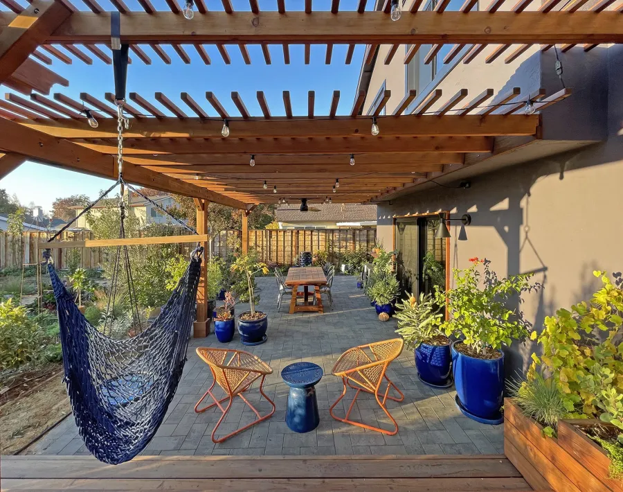 Attached Garden Pergolas (Options: 45'-6" L, One Section is 13' W and the Other Section is 15', Attached to Wall by Rafters Side, California Redwood, 1 Ceiling Fan Base, No Electrical Wiring Trim, Open Roof with Slats at 6", No Decorative Trims on Posts, 5-Post Anchor Kit for High-Wind, Transparent Premium Sealant). Photo Courtesy of D. Herman of Livermore, California.