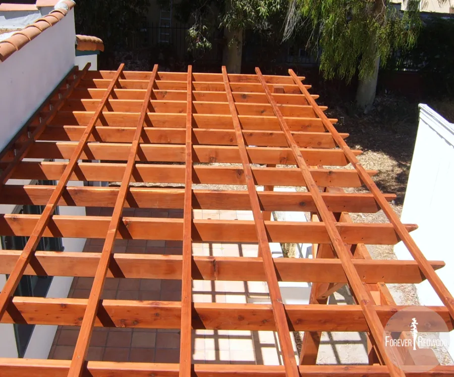 Attached Garden Pergolas (Options: 22' L x 10' W, Attached to Wall by Support Side, Mature Redwood, No Electrical Wiring Trim, Open Roof with Slats at 18", 3-Post Anchor Kit for Concrete, Transparent Premium Sealant).