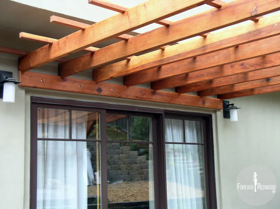 Attached Garden Pergolas (Options: 12' L x 12' W, Attached to Wall by Support Side, Mature Redwood, No Electrical Wiring Trim, Open Roof with Slats at 18", 2-Post Anchor Kit for Concrete, Transparent Premium Sealant).