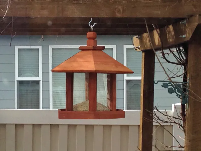 Aviary Oasis Bird Feeders (Options: Old-Growth Redwood, XW Roof Eaves, Transparent Premium Sealant).  Photo Courtesy of Marilyn Brooks of Star, Idaho.