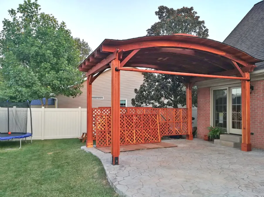 Backyard Pavilion Kits (Options: 12' L x 18' Arc W, California Redwood,  1 Electrical Wiring Trim, 4-Post Anchor Kit for High-Wind, No Ceiling Fan Base, 2 Privacy Panels, 1 Curtain Rod, 9.5 ft Post Height, Transparent Premium Sealant). Final Privacy Panel Install Pending. Photo Courtesy of C Liebo of Newburgh, Indiana.