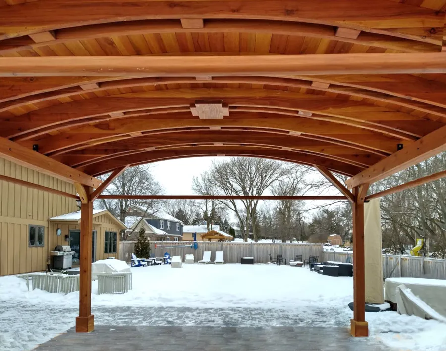 Backyard Pavilion Kits (Options: 15' L x 18' Arc W, California Redwood, 2 Post Electrical Wiring Trims, 4-Post Anchor Kit for Concrete, 1 Ceiling Fan Base, No Privacy Panels, 4 Curtain Rods, 9 ft Post Height, Transparent Premium Sealant). Photo Courtesy of M. McDonald of Lake Barrington, Illinois.