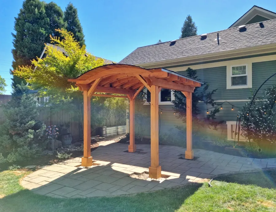 Backyard Pavilion Kits (Options: 10' x 10', Douglas-fir, Electrical Wiring Trim Kit for 1 Post, 4-Post Anchor Kit for High-Wind, No Ceiling Fan Base, No Privacy Panels, 1 Curtain Rod, 8 ft Post Height, Transparent Premium Sealant). Photo Courtesy of M. Olson of Newberg, OR.