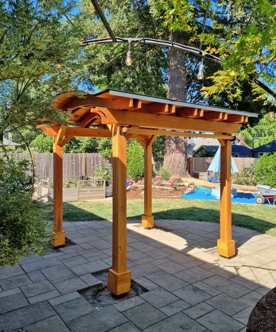 Backyard Pavilion Kits (Options: 10' x 10', Douglas-fir, Electrical Wiring Trim Kit for 1 Post, 4-Post Anchor Kit for High-Wind, No Ceiling Fan Base, No Privacy Panels, 1 Curtain Rod, 8 ft Post Height, Transparent Premium Sealant). Photo Courtesy of M. Olson of Newberg, OR.