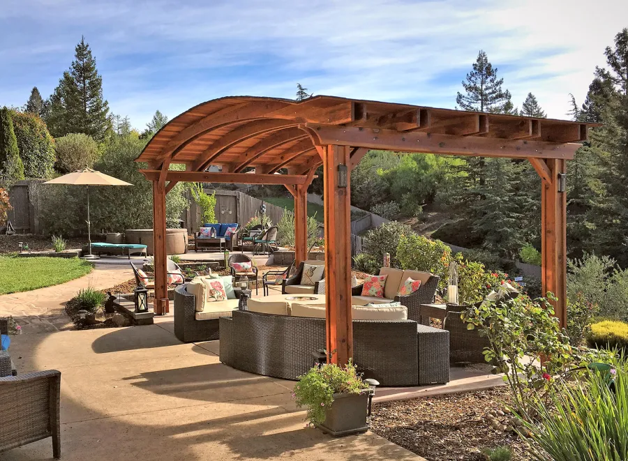 Backyard Pavilion Kits (Options: 12' L x 22' Arc W, California Redwood, No Electrical Wiring Trim, 4-Post Anchor Kit for High-Wind, No Ceiling Fan Base, No Privacy Panels, No Curtain Rods, 9.5 ft Post Height, Transparent Premium Sealant). Photo Courtesy of S. Bell of Santa Rosa, CA.