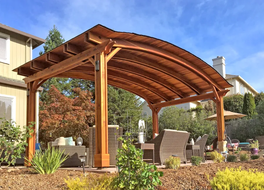 Backyard Pavilion Kits (Options: 12' L x 22' Arc W, California Redwood, No Electrical Wiring Trim, 4-Post Anchor Kit for High-Wind, No Ceiling Fan Base, No Privacy Panels, No Curtain Rods, 9.5 ft Post Height, Transparent Premium Sealant). Photo Courtesy of S. Bell of Santa Rosa, CA.