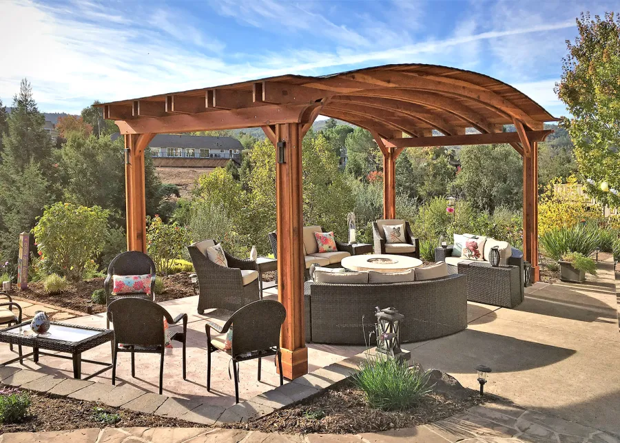 Backyard Pavilion Kits (Options: 12' L x 22' Arc W, California Redwood, No Electrical Wiring Trim, 4-Post Anchor Kit for High-Wind, No Ceiling Fan Base, No Privacy Panels, No Curtain Rods, 9.5 ft Post Height, Transparent Premium Sealant). Photo Courtesy of S. Bell of Santa Rosa, CA.