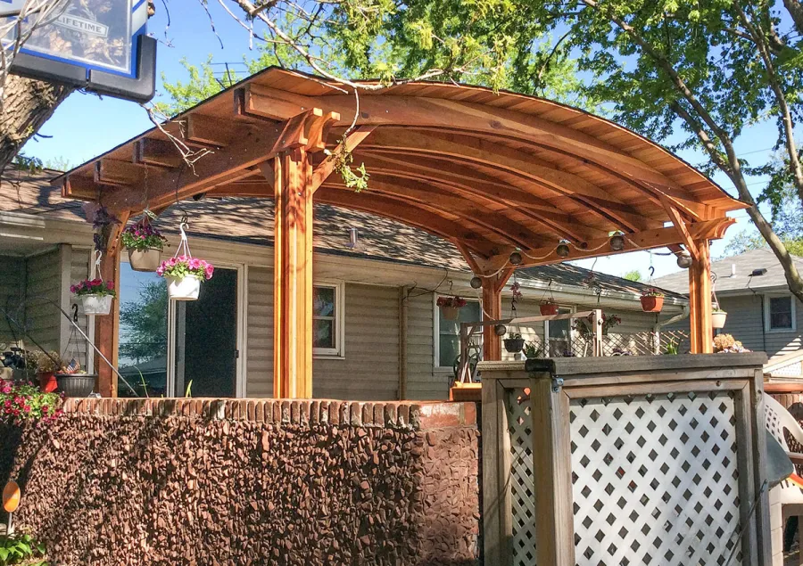 Backyard Pavilion Kits (Options: 20' x 12', California Redwood, No Electrical Wiring Trim Kit, 4-Post Anchor Kit for Stone, No Ceiling Fan Base, No Privacy Panels, No Curtain Rods, 10 ft Post Height, Transparent Premium Sealant). Photo Courtesy of Gary C. of Blaine, Minnesota.
