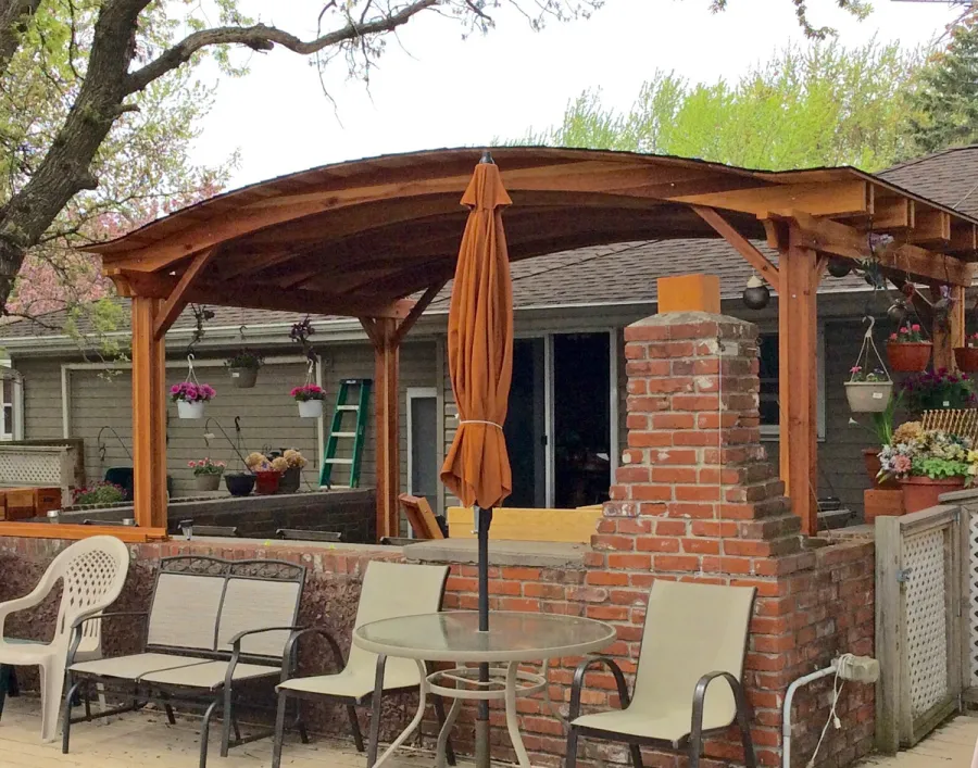 Backyard Pavilion Kits (Options: 20' x 12', California Redwood, No Electrical Wiring Trim Kit, 4-Post Anchor Kit for Stone, No Ceiling Fan Base, No Privacy Panels, No Curtain Rods, 10 ft Post Height, Transparent Premium Sealant). Photo Courtesy of Gary C. of Blaine, Minnesota.