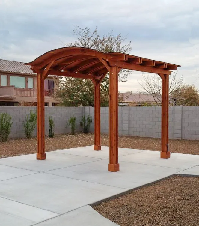 Backyard Pavilion Kits (Options: 12' x 12', Mature Redwood, Electrical Wiring Trim Kit for 2 Posts, 4-Post Anchor Kit for Stone, Add Ceiling Fan Base, No Privacy Panels, No Curtain Rods, 10 ft Post Height, Transparent Premium Sealant). Photo Courtesy of Connie Josephson of Laveen, Arizona.