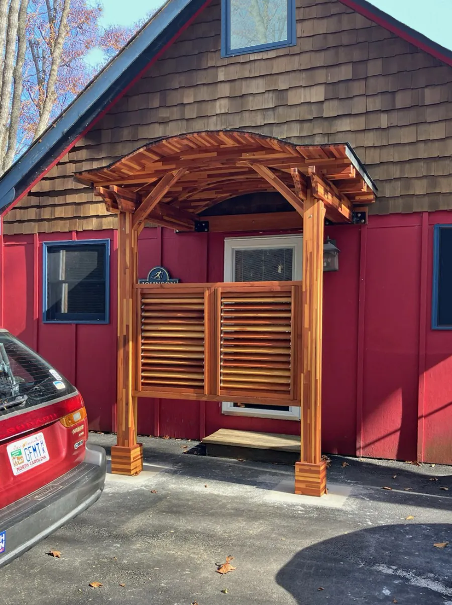 Custom Backyard Porch Pavilion (Options: 6 'L x 8' W, Mosaic Redwood, 2-Post Anchor Kit for High Wind, 2 Electrical Wiring Trims, 9 ft Post Height, No Ceiling Fan Base, No Curtain Rods, with Fixed Half Height Panel, Transparent Premium Sealant). Photo Courtesy C. Johnson of Banner Elk, NC.