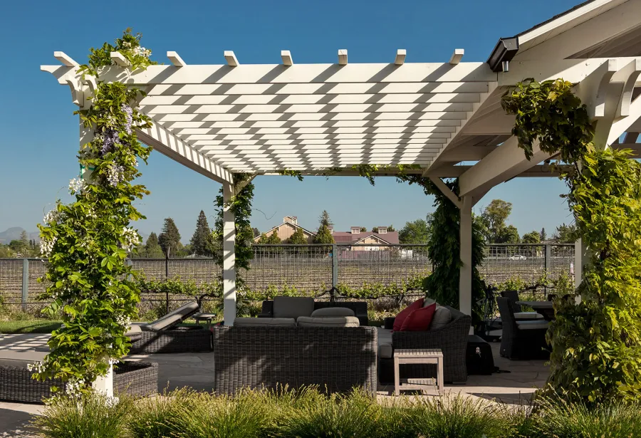 Custom Wooden Pergola with Attached Pavilion (Options: 26' L x 12' W, California Redwood, No Electrical Wiring Trim Kit, Post Anchor Kit for High-Wind, Custom White Paint) with a Garden Pergola Attached. Photo Courtesy of M. Hansen of St. Helena, California.