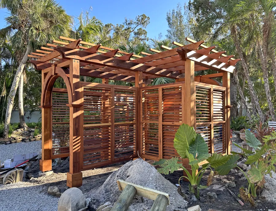 Custom Garden Pergola (Options: L-Shaped, Mature Redwood, with Louvered Walls, Transparent Premium Sealant). Photo Courtesy of S. Hase of Longboat Key, FL.