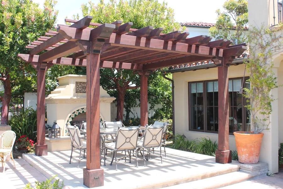 Custom Wooden Fat Timber Pergola (Options: 15' L x 15' W, Old Growth Redwood, Include Wiring Trim for 1 Post, Open Roof with Slats at 18" Rafters at 18" Roof Support Timbers, 4-Post Anchor Kit for Concrete, No Ceiling Fan Base, No Privacy Panels, No Curtain Rods, 11ft 6in Post Height square to outside corners, Include enough overhang to go to full 15 ft square roof size., Coffee-Stain Premium Sealant). Photo Courtesy of Bruce K. of Newport Coast, CA.