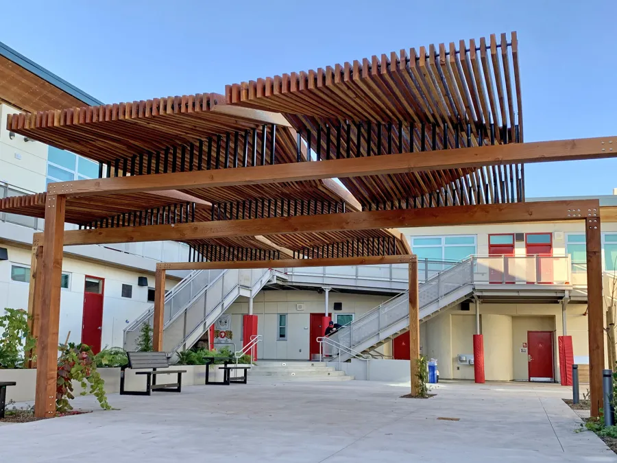 Custom Wooden Pergola (Options: California Redwood, Custom Post Anchor Kit, Transparent Premium Sealant). Installled in The Carey School at 1 Carey School Lane, San Mateo, CA 94403. 