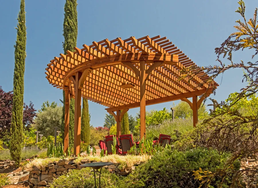 Custom Wooden Pergola (Options: 17' L x 17' W, California Redwood, Electrical Wiring Trim for 1 Post, 5-Post Anchor Kit for Concrete, No Ceiling Fan Base, No Privacy Panels, No Curtain Rods, Transparent Premium Sealant). Photo Courtesy of K. Drahmann of El Dorado Hills, CA.