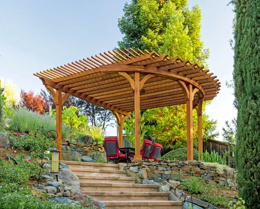 Custom Wooden Pergola (Options: 17' L x 17' W, California Redwood, Electrical Wiring Trim for 1 Post, 5-Post Anchor Kit for Concrete, No Ceiling Fan Base, No Privacy Panels, No Curtain Rods, Transparent Premium Sealant). Photo Courtesy of K. Drahmann of El Dorado Hills, CA.