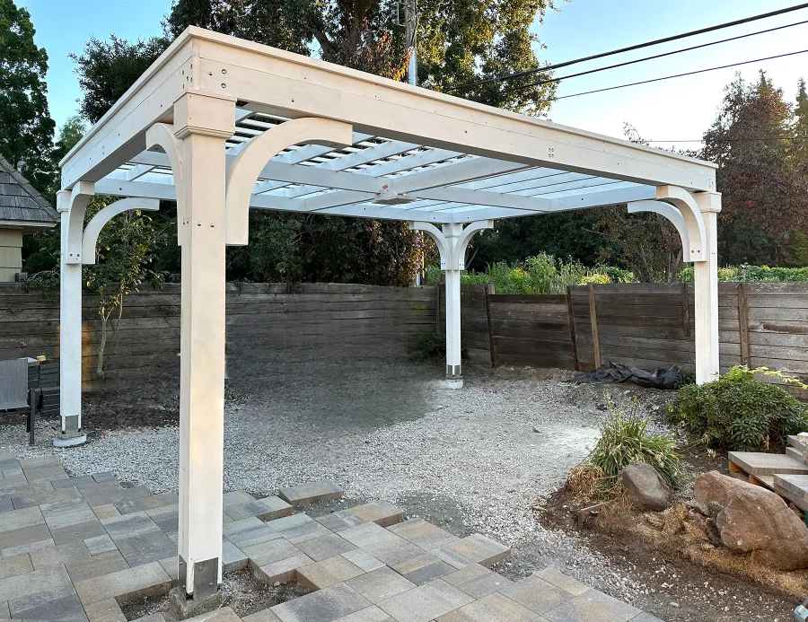 Custom Wooden Pergola (Options: 15' x 20', Douglas-fir, 9.5' H Posts, 8x8 Posts, Electrical Wiring Trim Kit for All Posts, 1 Ceiling Fan Base, Horizontal Decorative Trims for All Posts, Posts Anchor Kit for High-Wind, Off-White Oil-Based Primer). Photo Courtesy of K. Kramer of East Palo Alto, CA.
