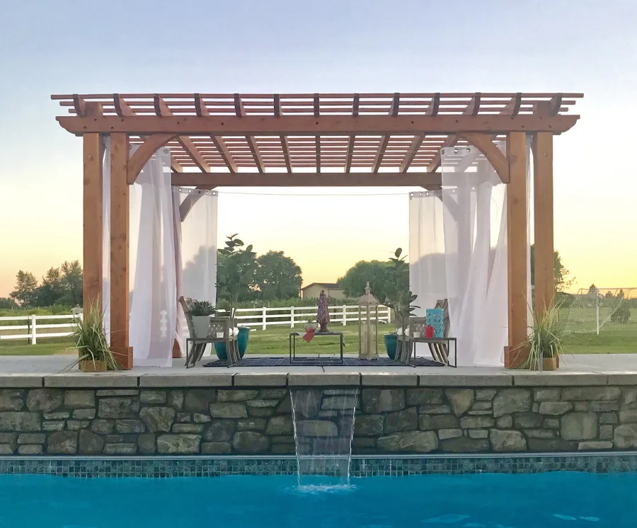 Custom Garden Pergola (Options: 20' x 14', Douglas-fir, Slats at 12" On Center and Rafters at 18" On Center, Open Roof, 10' H Posts, 8x8 Dual Posts and 3x8 Roof Timbers by Custom Request, Post Anchor Kit for Concrete, Transparent Premium Sealant). Photo Courtesy of K. Copeland of Sunnyside, Washington.