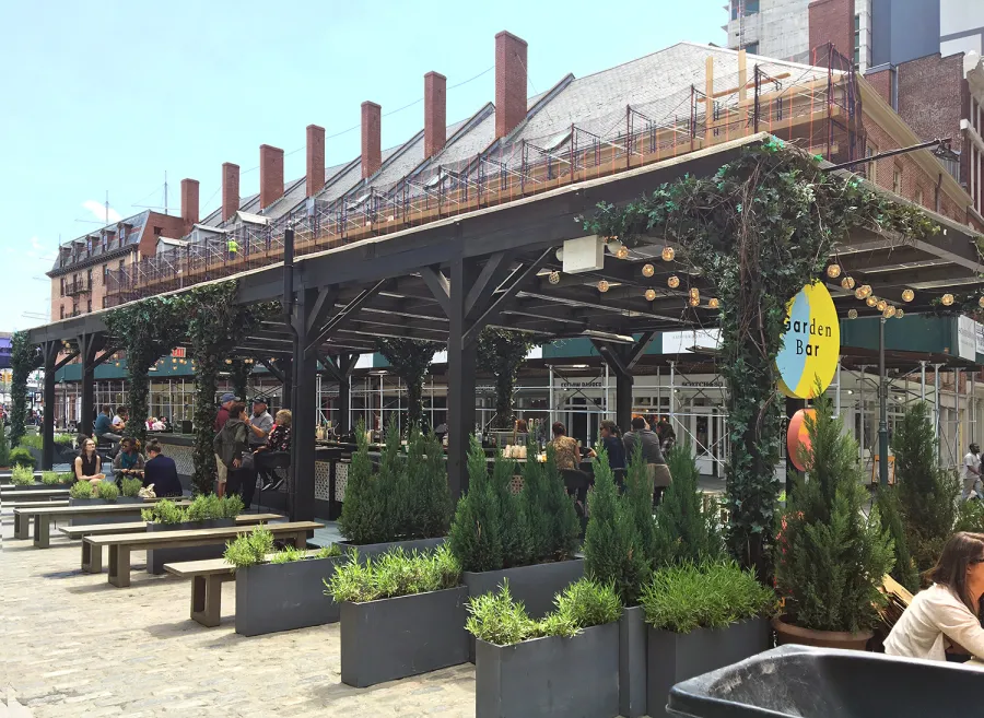 Custom Wooden Pergola (Options: 82' L x 16' W, Douglas-fir, Open Roof with Rafters at 18", with Transparent Rain Guard, 12-Post Anchor Kit, No Ceiling Fan Base, 12' Post Height, Custom Black Paint). This pergola is part of the giant popup beer hall at the Southside Seaport in downtown Manhattan from May to Oct 2017: https://www.timeout.com/newyork/blog/a-giant-pop-up-beer-hall-is-opening-at-south-street-seaport-this-summer-032417