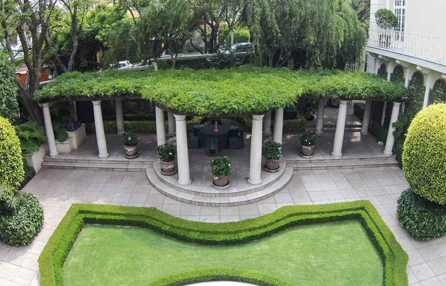 Custom Wooden Pergola (Options: 50' half circle, Old-Growth Redwood, No Posts, Transparent Premium Sealant). Pergola Installed in Mexico City. Photo Courtesy of Alfonso Barajas.