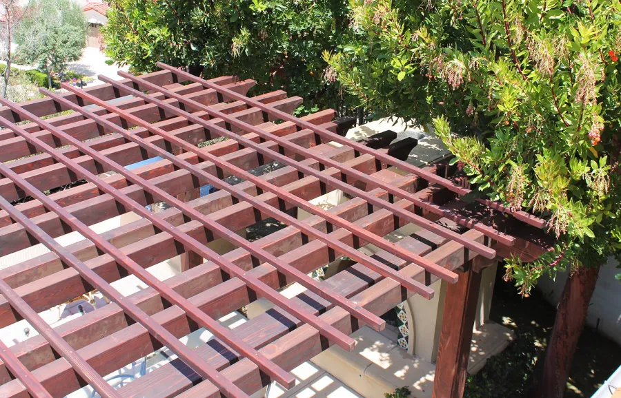 Custom Wooden Fat Timber Pergola (Options: 15' L x 15' W, Old Growth Redwood, Include Wiring Trim for 1 Post, Open Roof with Slats at 18" Rafters at 18" Roof Support Timbers, 4-Post Anchor Kit for Concrete, No Ceiling Fan Base, No Privacy Panels, No Curtain Rods, 11ft 6in Post Height square to outside corners, Include enough overhang to go to full 15 ft square roof size., Coffee-Stain Premium Sealant). Photo Courtesy of Bruce K. of Newport Coast, CA.