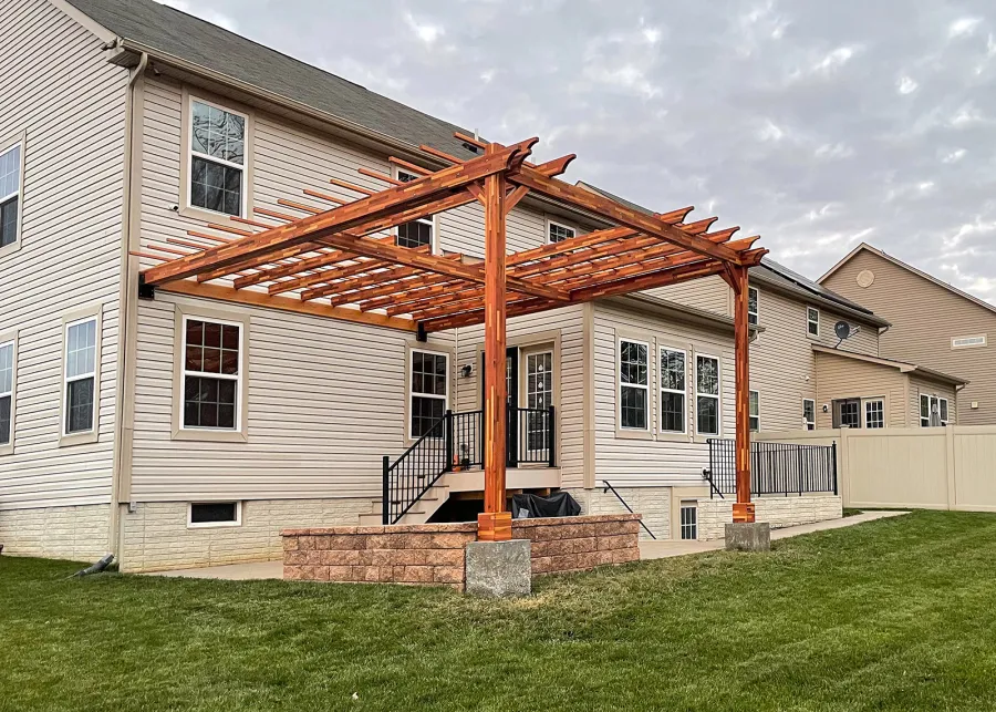 Custom Attached Wooden Pergola (Options: 18' W x 22' L, Mosaic Redwood, 12' H Posts, Transparent Premium Sealant). Photo Courtesy of Anthony Campanale of Waldorf, MD.