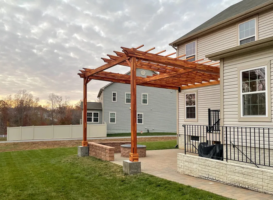 Custom Attached Wooden Pergola (Options: 18' W x 22' L, Mosaic Redwood, 12' H Posts, Transparent Premium Sealant). Photo Courtesy of Anthony Campanale of Waldorf, MD.