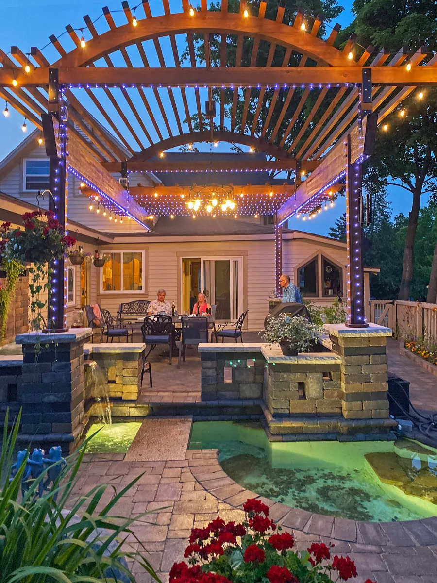 Custom Wooden Pergola (Options: 30' L x 18' W, California Redwood, No Electrical Wiring Trim, Trims to Cover 3 Metal Posts Installed by Customer, Coffee-Stain Premium Sealant). Photo Courtesy of K. Lufkin of Petoskey, Michigan.