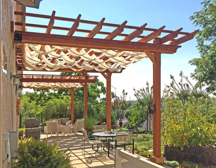Custom Wooden Pergola (Options: 35' L, 13' W, California Redwood, No Electrical Wiring Trim, 4-Post Anchor Kit for Concrete, No Privacy Panels, No Curtain Rods, 10' & 11' Post Height, Transparent Premium Sealant). Photo Courtesy of D. Drake of Auburn, CA.