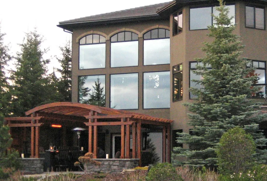 Custom Wooden Pergola (Options: 24' x 22', California Redwood, Open Roof with Rafters at 15", 9' Post Height [Front Posts 2' Shorter], Transparent Premium Sealant). Photo Courtesy of Kelly Fraser of Okotoks, AB, Canada.