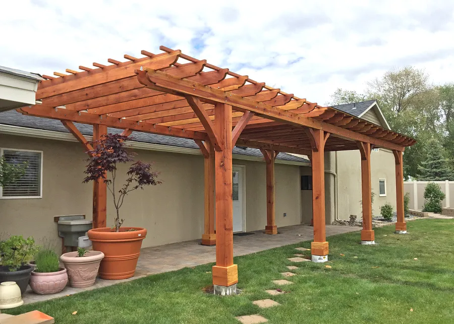 Custom Wooden Pergola (Options: 14' L x 12' W, California Redwood, One Ceiling Fan Base, Electrical Wiring Trim Kit for 1 Post, 8-Post Anchor Kit for High-Wind, 8 x 8 Posts by Custom Request, Transparent Premium Sealant) with a 12' x 24' Shed Pavilion Attached. Photo Courtesy of G. Scotzin of Pasco, WA.