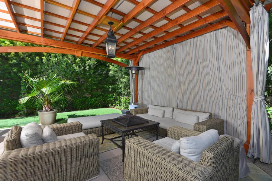 Custom Wooden Pergola (Options: 17' x 15', California Redwood, 1 Ceiling Fan Base, Custom Arched Brace on Supports Side, Transparent Premium Sealant). Photo Courtesy of Jason Jager.