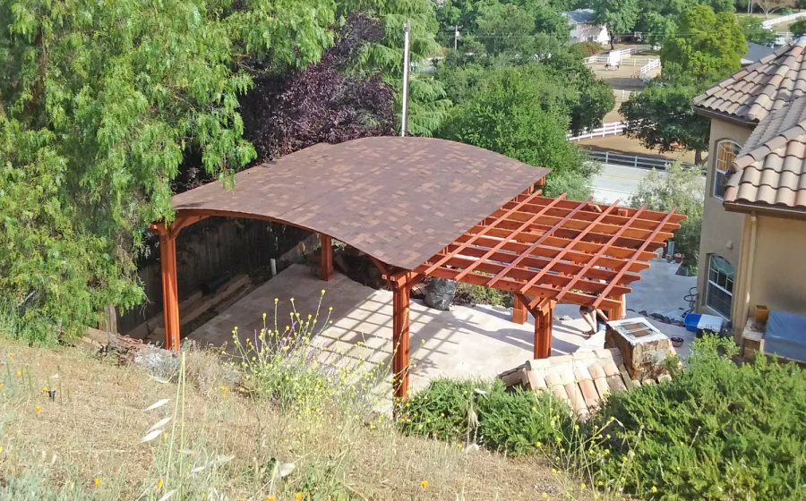 Custom Wooden Pergola with Pavilion (Options: Mature Redwood with Pavilion Ceiling in Old-Growth Redwood, with 2 Fan Bases, Electrical Wiring Trim Kit for 1 Post, 6-Post Anchor Kit for High-Wind, Transparent Premium Sealant). Backyard Pavilion is sized 18 x 18 ft and Garden Pergola is 9 x 14 ft. Yes, you can mix and match different pergola and pavilions in almost any size and configuration to make the perfect shade structure for your yard. Photo Courtesy of Joan Angwin of Morgan Hill, CA.