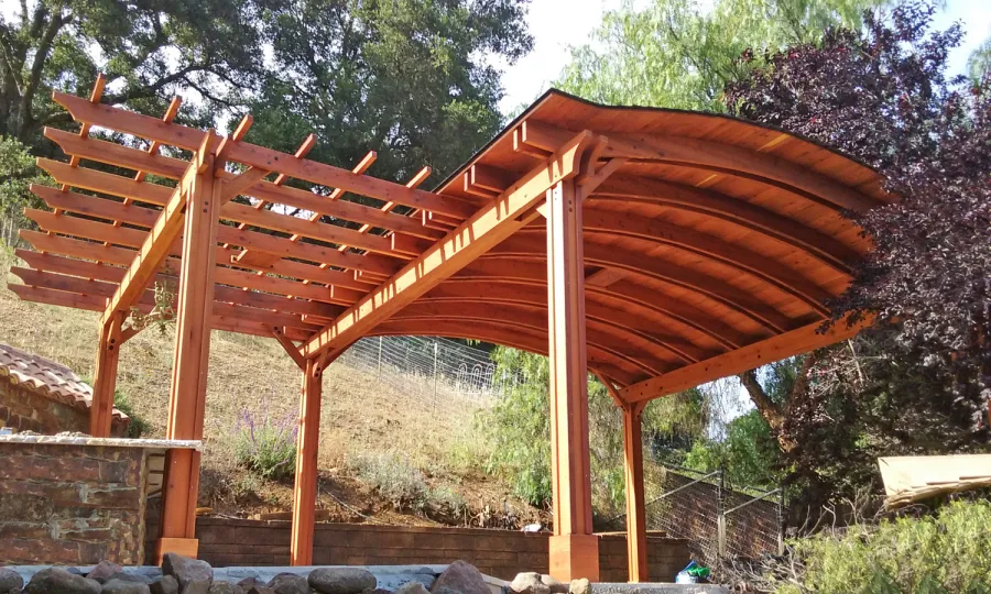 Custom Wooden Pergola with Pavilion (Options: Mature Redwood with Pavilion Ceiling in Old-Growth Redwood, with 2 Fan Bases, Electrical Wiring Trim Kit for 1 Post, 6-Post Anchor Kit for High-Wind, Transparent Premium Sealant). Backyard Pavilion is sized 18 x 18 ft and Garden Pergola is 9 x 14 ft. Yes, you can mix and match different pergola and pavilions in almost any size and configuration to make the perfect shade structure for your yard. Photo Courtesy of Joan Angwin of Morgan Hill, CA.