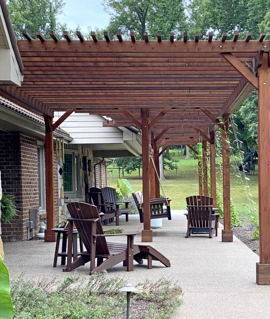 Custom Wooden Pergola (Options: 64' L x 14'-5" W, Mature Redwood, No Electrical Wiring Trim, 9-Post Anchor Kit for Concrete, No Ceiling Fan Base, No Privacy Panels, No Curtain Rods, Transparent Premium Sealant). Photo Courtesy of K. Feliciani of Greensburg, Pennsylvania.