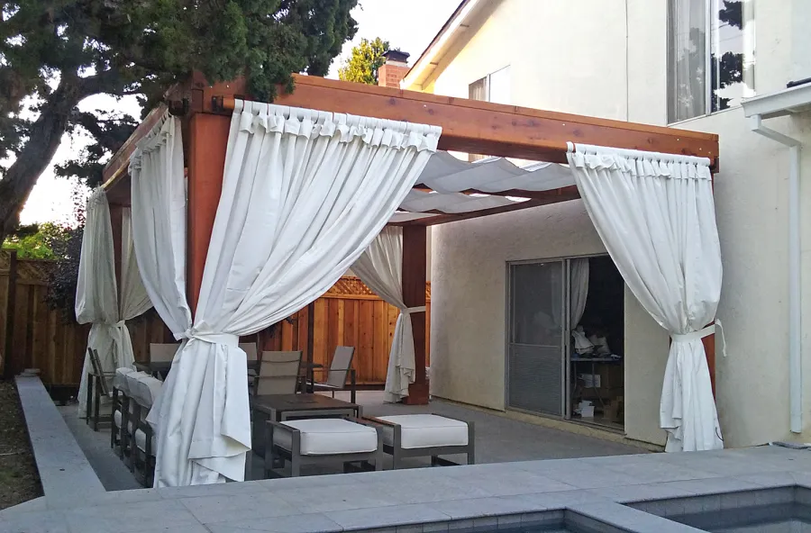 Custom Wooden Fat Timber Pergola (Options: 20' L, 16' W, Old-Growth Redwood, 4 Electrical Wiring Trims, with 2 3/4" x 11 1/4" Roof Timbers and 11 1/4" x 11 1/4" Posts, 4-Post Anchor Kit for High-Wind, No Privacy Panels, Curtain Rods on 4 sides, 10' Post Height, Transparent Premium Sealant). Retractable Canopy designed in cooperation with Infinity Canopy of Los Angeles, CA (www.infinitycanopy.com). Once you have your design finalized, you can forward your drawings to Infinity to add the perfect retractable canopy solution for maximum shade versatility! Photo Courtesy of Darren & Elva Linscott of San Jose, CA.