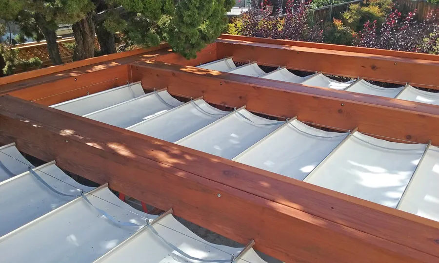 Custom Wooden Fat Timber Pergola (Options: 20' L, 16' W, Old-Growth Redwood, 4 Electrical Wiring Trims, with 2 3/4" x 11 1/4" Roof Timbers and 11 1/4" x 11 1/4" Posts, 4-Post Anchor Kit for High-Wind, No Privacy Panels, Curtain Rods on 4 sides, 10' Post Height, Transparent Premium Sealant). Retractable Canopy designed in cooperation with Infinity Canopy of Los Angeles, CA (www.infinitycanopy.com). Once you have your design finalized, you can forward your drawings to Infinity to add the perfect retractable canopy solution for maximum shade versatility! Photo Courtesy of Darren & Elva Linscott of San Jose, CA.