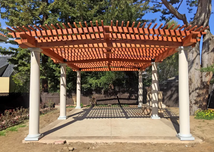 Custom Wooden Pergola (Options: 19' x 32', Mature Redwood, 4-Post Anchor Kit for High-Wind, Trasnparent Premium Sealant). Customer Placed Tuscan Columns Around the Pergola Posts. Photo Courtesy of M. McCook of San Mateo, CA.