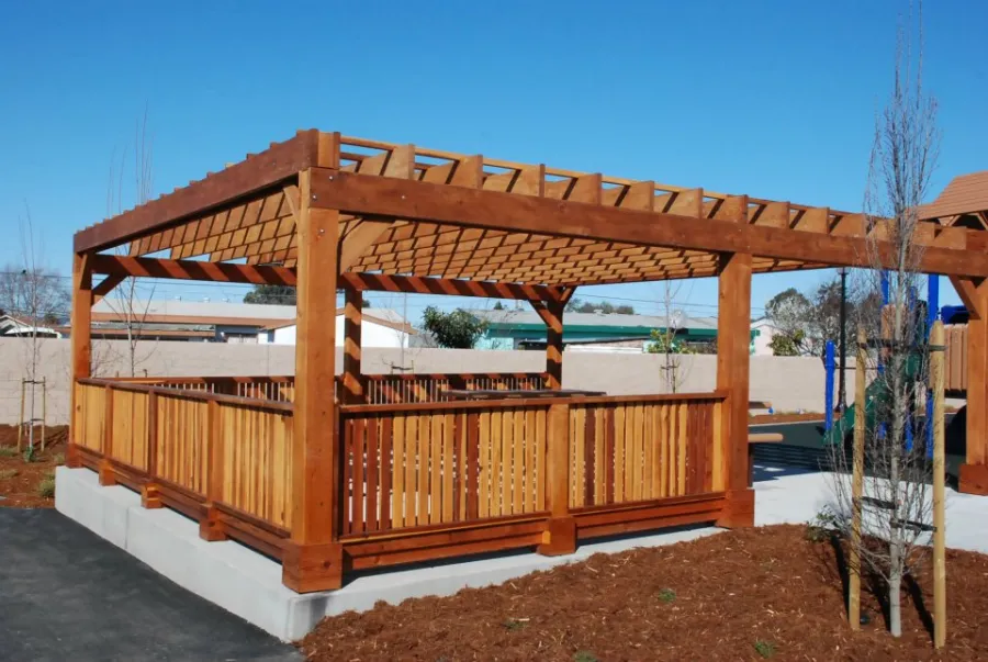 Custom Wooden Pergola (Options: 24' x 24', California Redwood, Open Roof with Slats at 18", Rafters at 18", 1¾" x 9¼" Supports and Rafters, 8 x 8 Posts, Transparent Premium Sealant). Photo Courtesy of Wanlass Park of San Pablo, CA. 