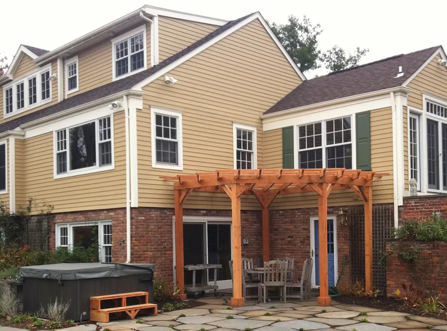 Custom Wooden Pergola (Options: 16' L, 14' W, Mature Redwood, No Electrical Wiring Trim, Open Roof with Slats at 18", Rafters at 18", Lengthwise Roof Support Timbers, 4-Post Anchor Kit for Stone, No Privacy Panels, No Curtain Rods, 9ft Post Height, Transparent Premium Sealant ). Photo Courtesy of Deborah Pasik of Morristown, New Jersey.