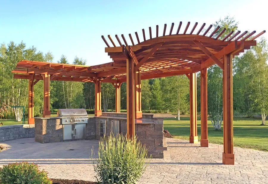 Custom Wooden Pergola (Options: 33' L, 11'-6" W, California Redwood, 1 Electrical Wiring Trim, 10-Post Anchor Kit for Concrete, No Privacy Panels, No Curtain Rods, 9' Post Height, Transparent Premium Sealant). Photo Courtesy of D. Pollock of Baldwinsville, NY.