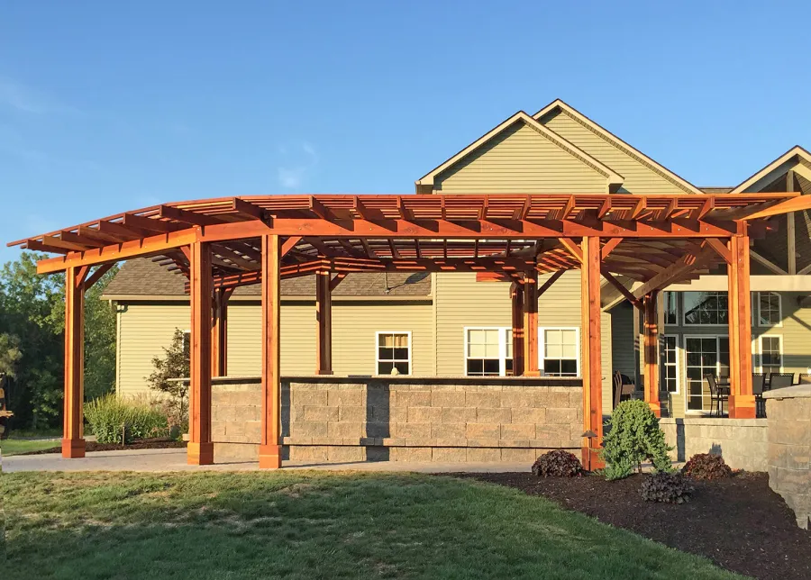 Custom Wooden Pergola (Options: 33' L, 11'-6" W, California Redwood, 1 Electrical Wiring Trim, 10-Post Anchor Kit for Concrete, No Privacy Panels, No Curtain Rods, 9' Post Height, Transparent Premium Sealant). Photo Courtesy of D. Pollock of Baldwinsville, NY.