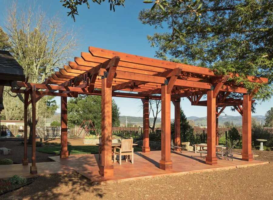 Custom Wooden Pergola (Options: 28' x 20', California Redwood, Posts Anchor Kit for Concrete, Transparent Premium Sealant). Photo Courtesy of S. Taplin of St. Helena, CA.